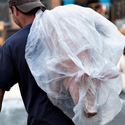 Meat being brought into the West Side Market, as seen by Cleveland photographer Barney Taxel.